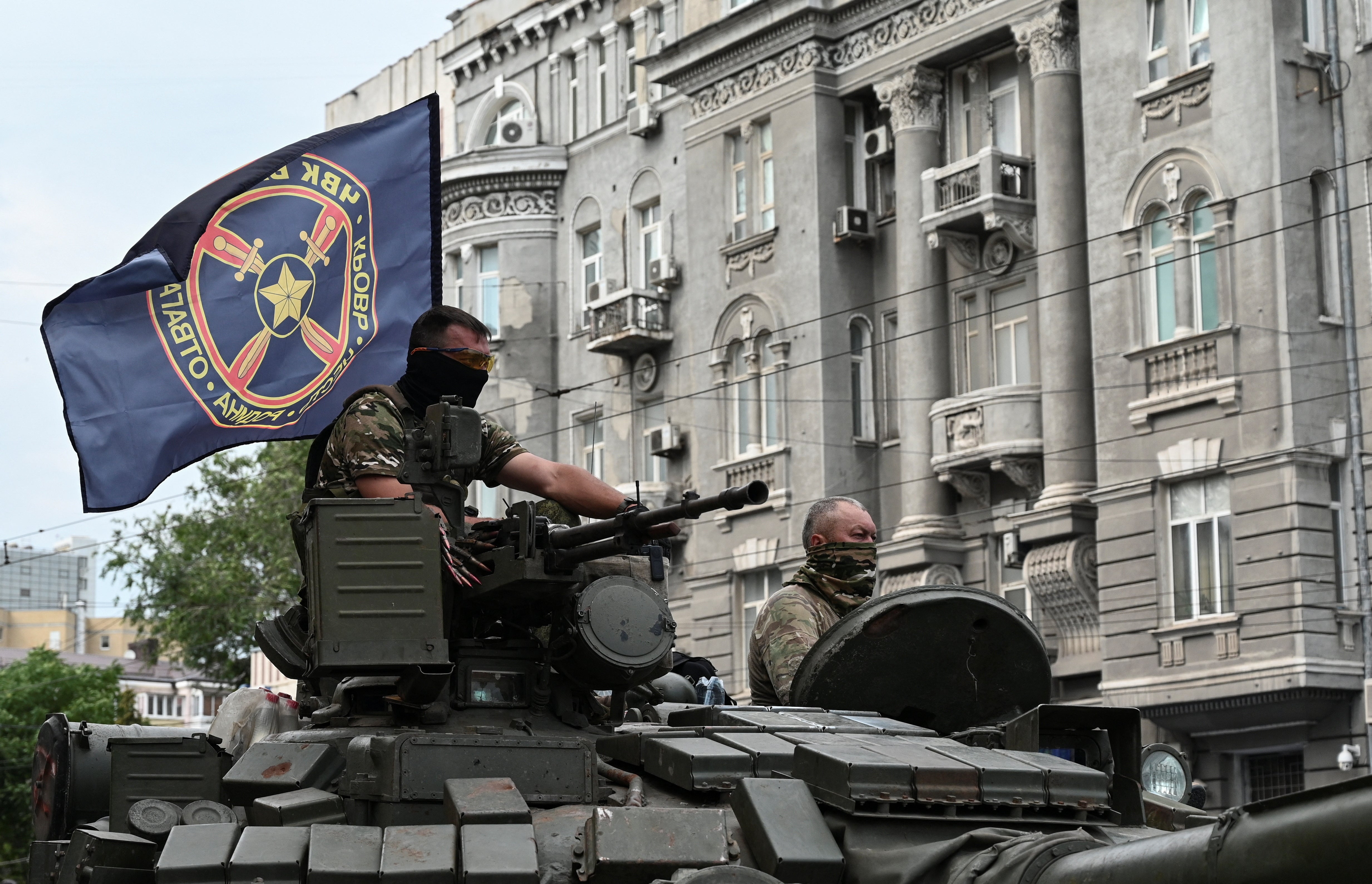 Fighters of Wagner private mercenary group are seen atop of a tank while being deployed near the headquarters of the Southern Military District in the city of Rostov-on-Don