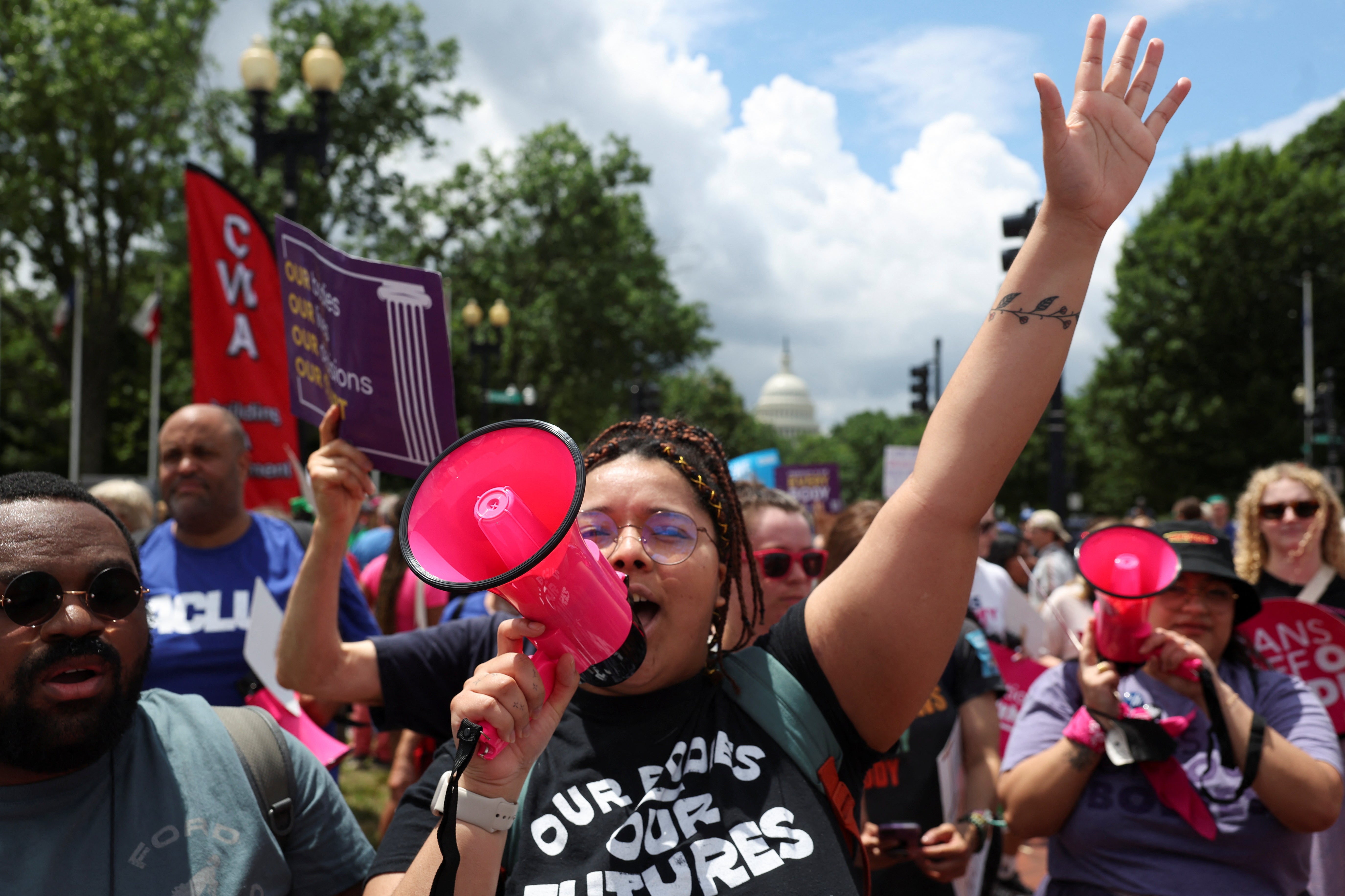 Abortion rights supporters marched to the Supreme Court in Washington DC to mark the one-year anniversary of a decision to overturn Roe v Wade.