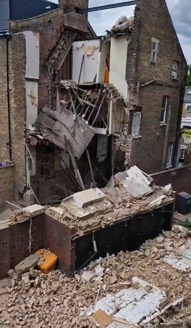 <p>An entire three-storey house collapsed in Hackney, London </p>