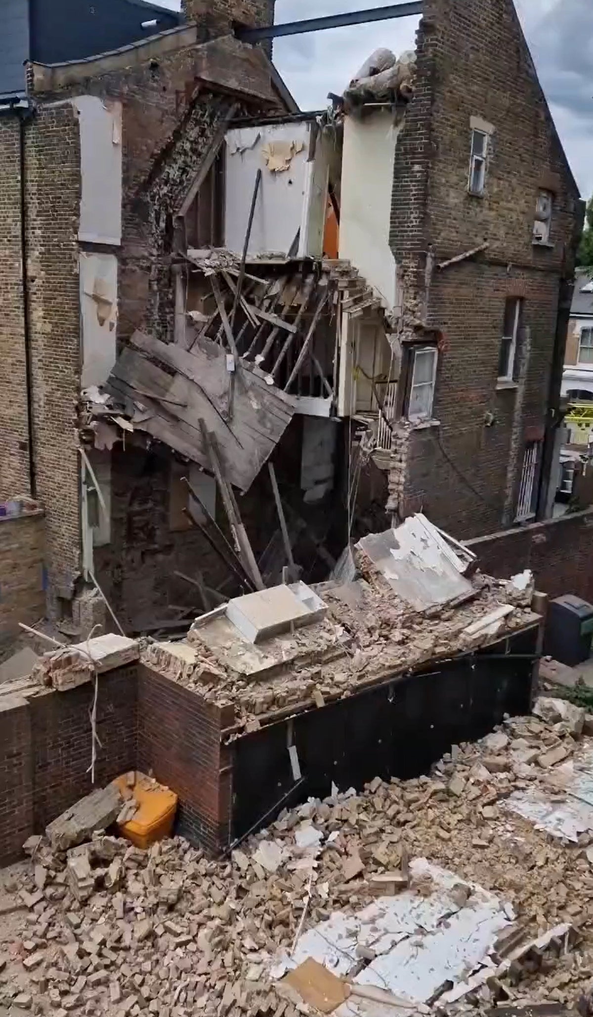 ‘Like an earthquake’: Man opens window to see three-storey house collapse