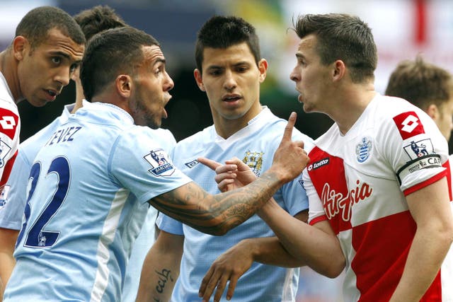 Joey Barton (right) was initially sent off for clashing with Manchester City’s Carlo Tevez (Peter Byrne/PA)