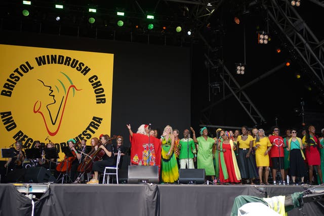 The Bristol Reggae Orchestra, featuring the Windrush Choir, opened the main stage on Sunday (Yui Mok/PA)
