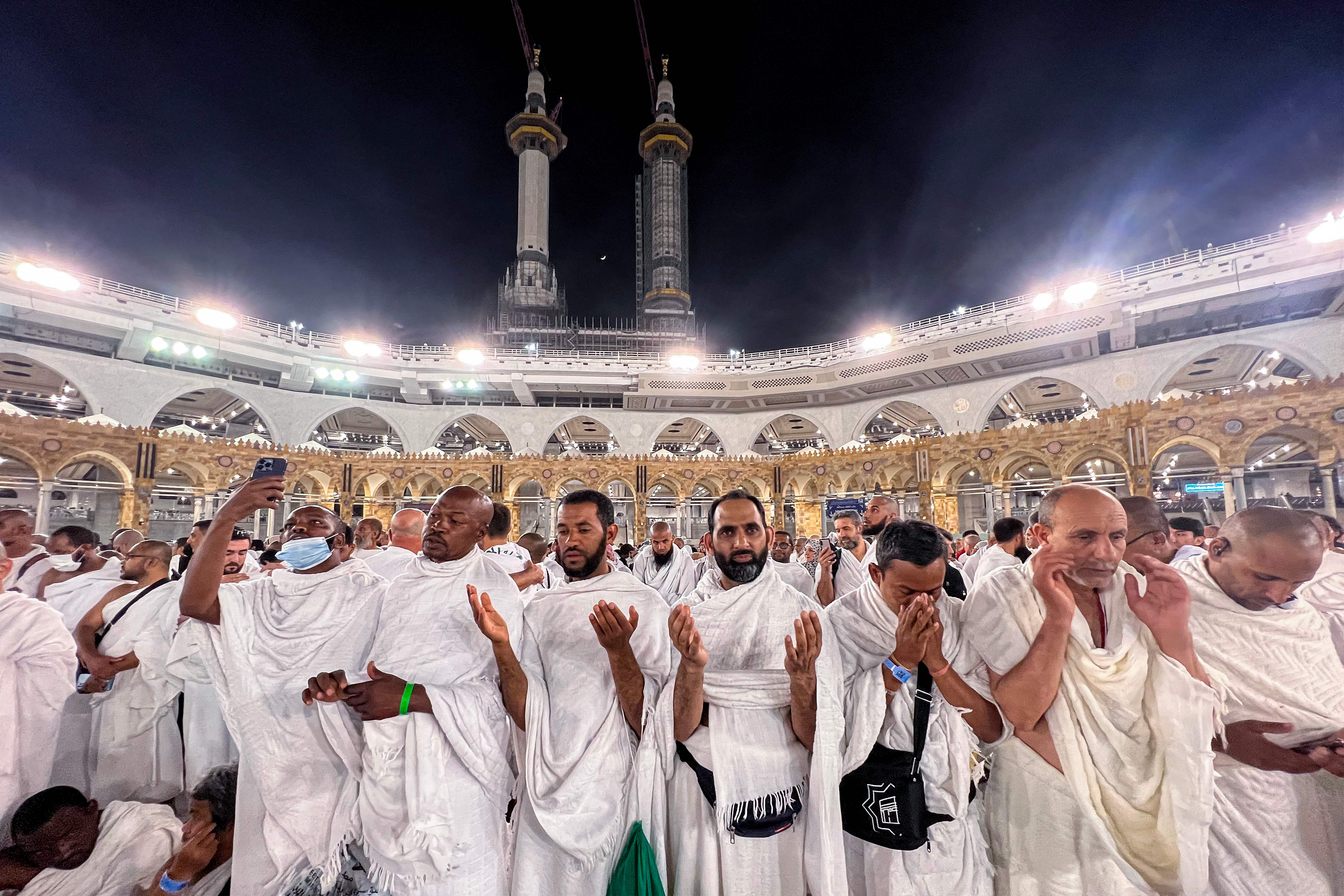 Muslim pilgrims pray at the Grand Mosque in the holy city of Mecca