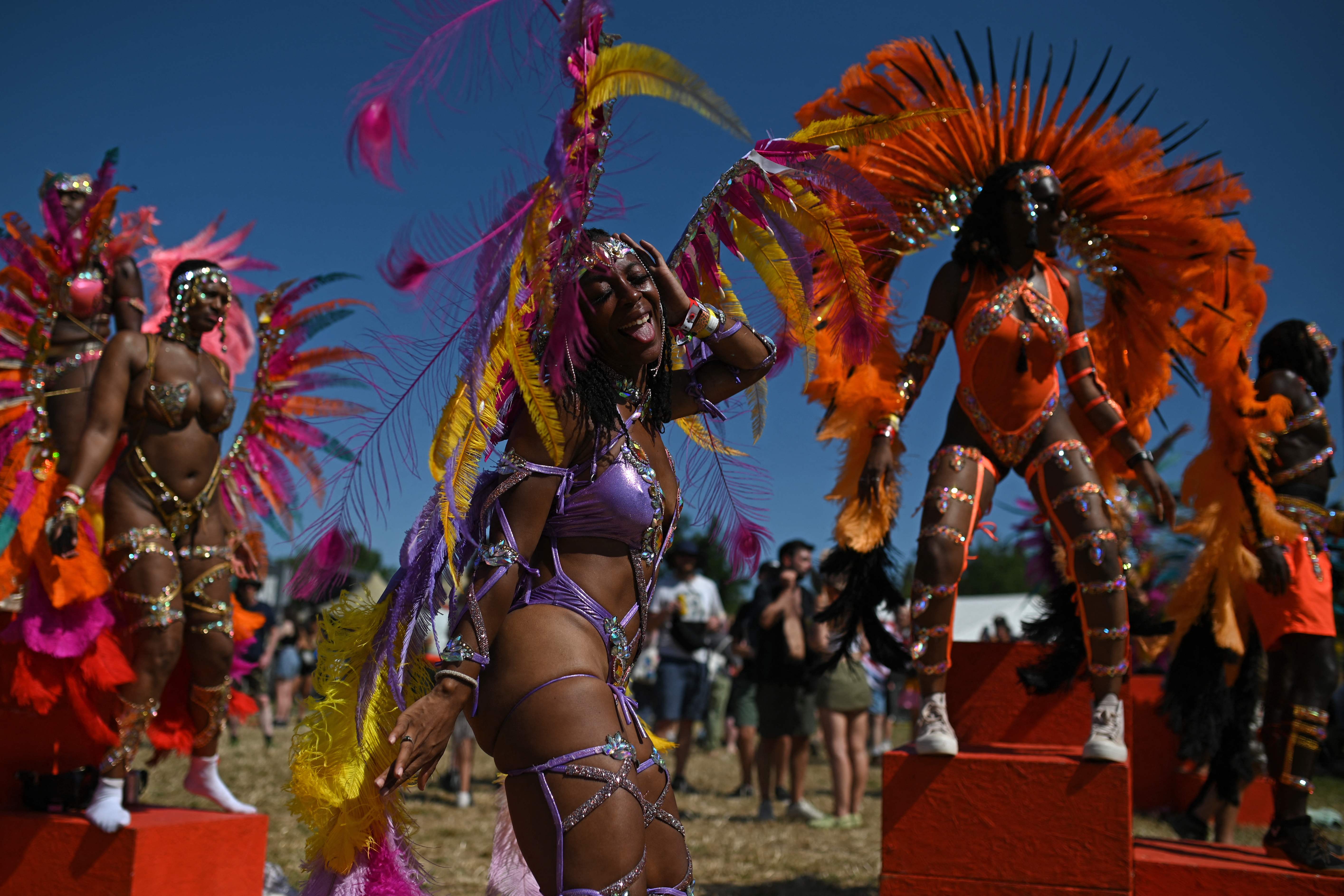 Performers from the Notting Hill Carnival dance at Glastonbury festival in Somerset