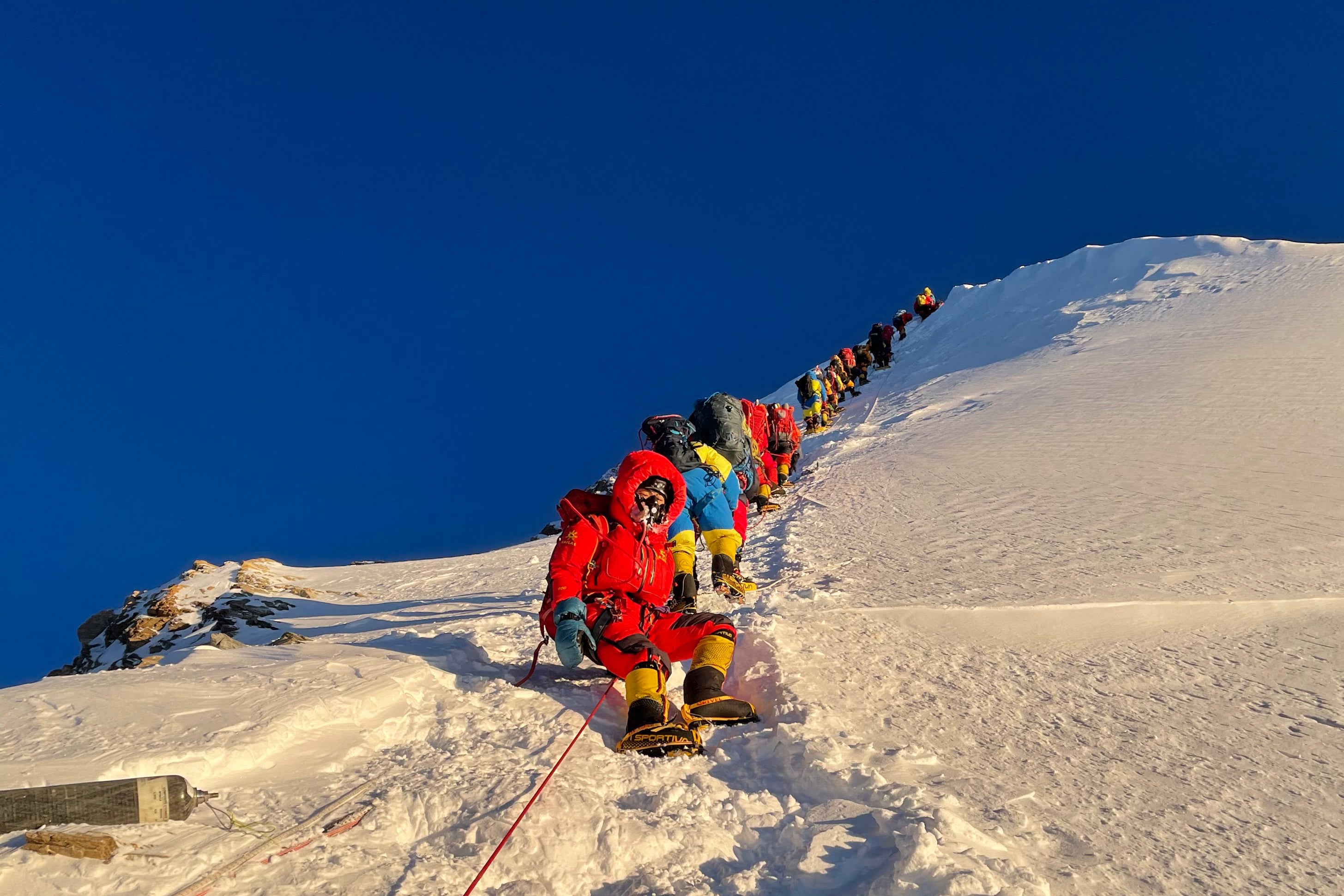 This photograph taken on 12 May shows mountaineers as they climb during their ascent to Mount Everest’s 8,849m high summit
