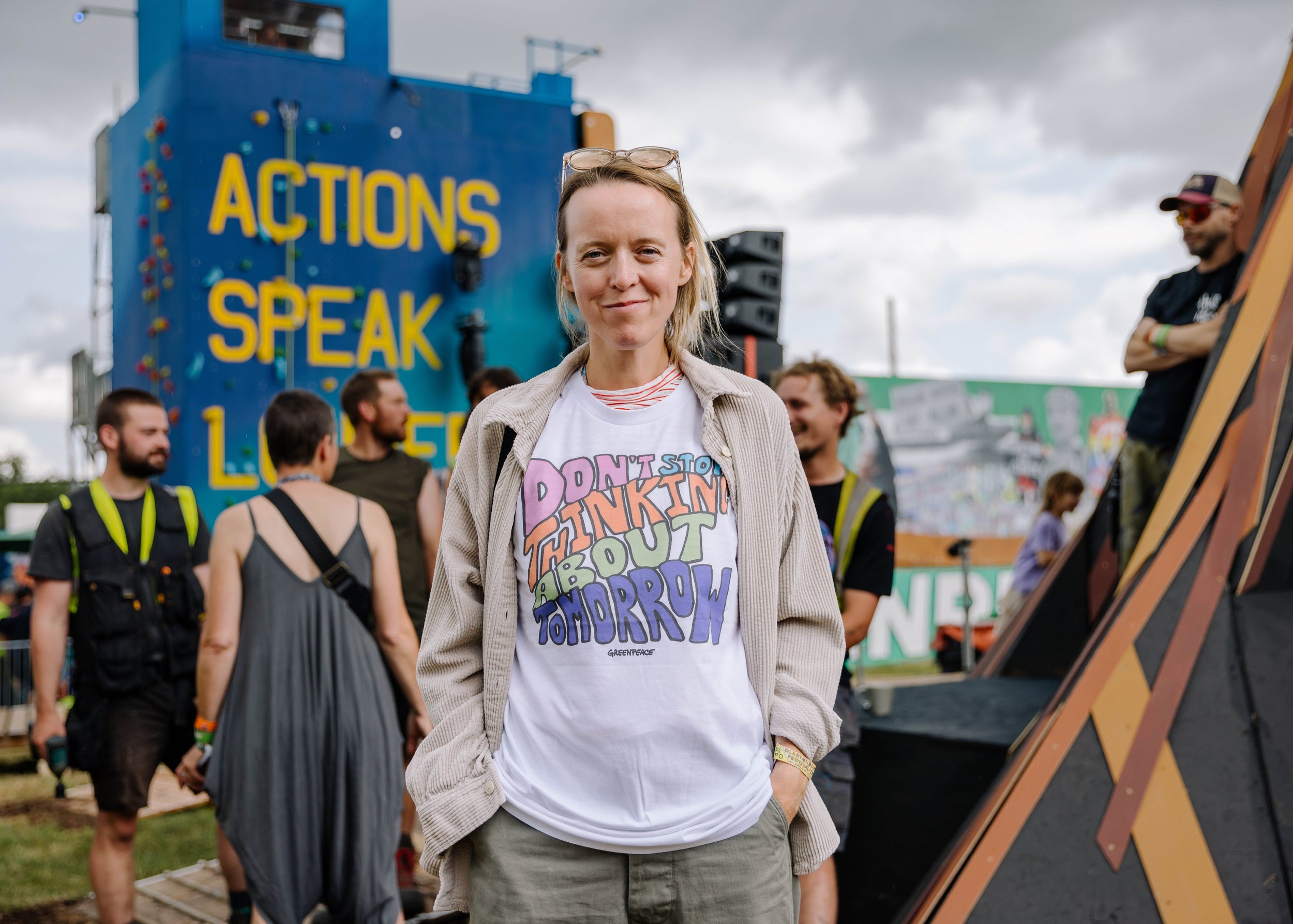 Festival organiser Emily Eavis wearing a Greenpeace ‘Don’t Stop Thinking About Tomorrow’ T-shirt at Glastonbury 2023