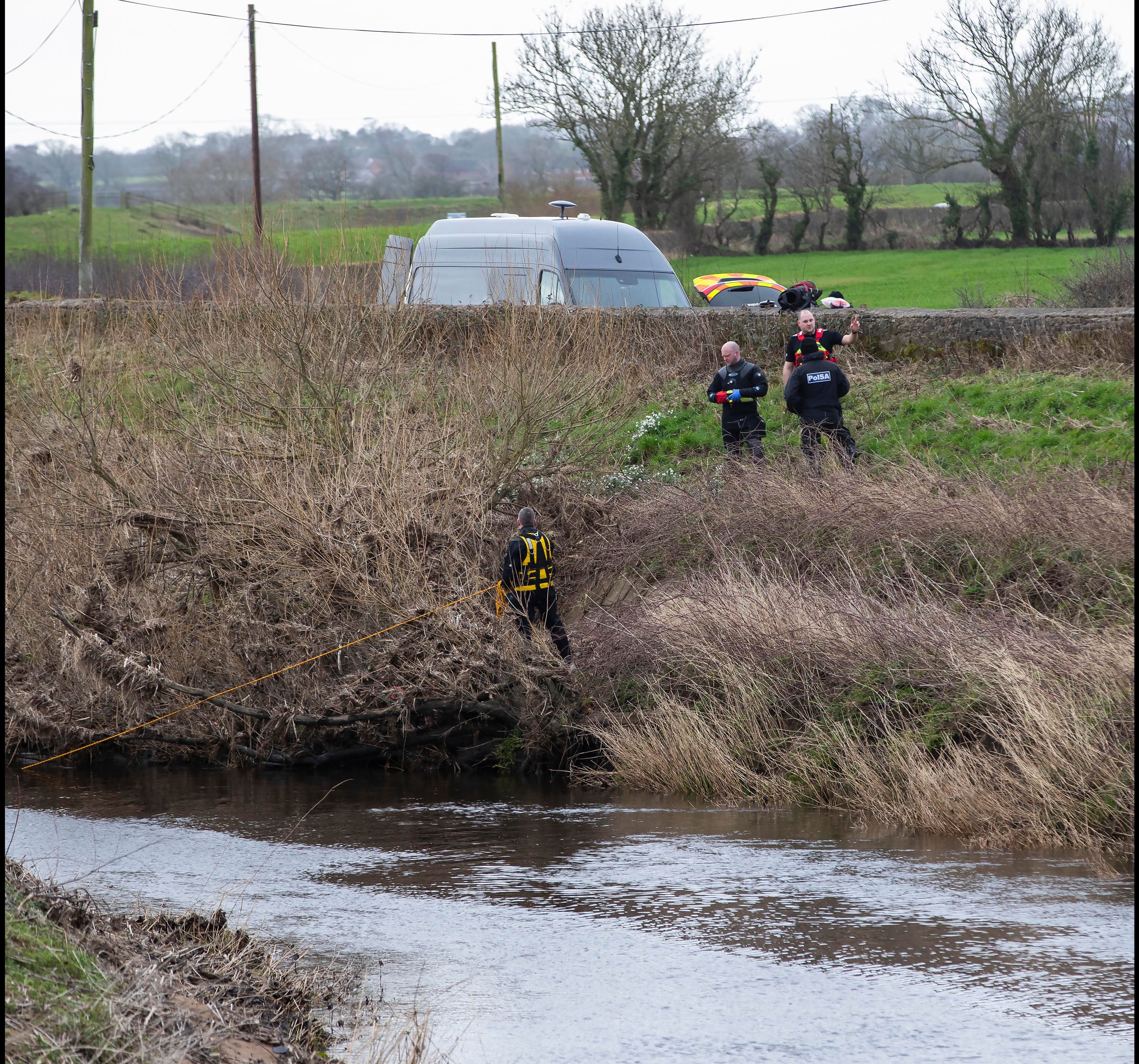 A police diving team searched the River Wyre for the body of the missing mum