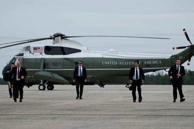 <p>Members of the Secret Service arrive to board Air Force One to escort US President Donald Trump at Andrews Air Force Base May 4, 2017 in Maryland</p>