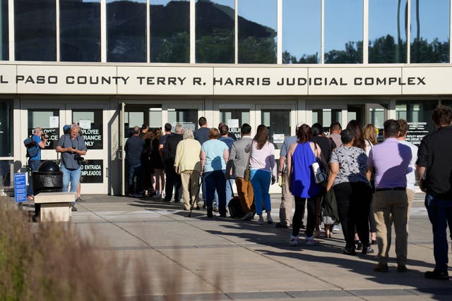 <p>A long line of people wait to clear security to enter the El Paso County Terry R. Harris Judicial Complex, Monday, June 26, 2023, in Colorado Springs, Colo. </p>