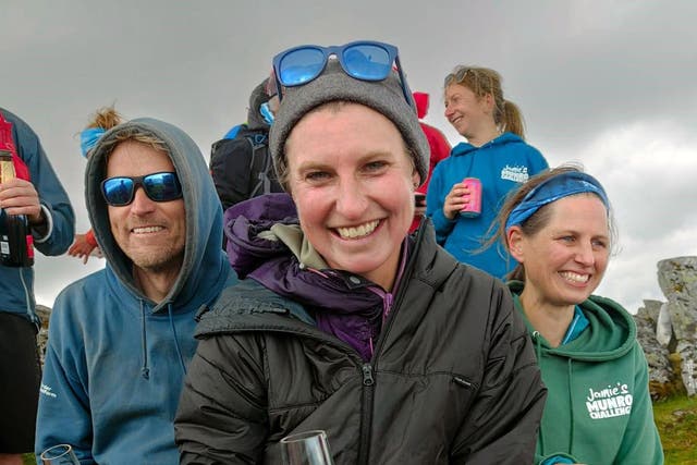 Ultra-runner Jamie Aarons, 43, celebrating with supporters at the end of the trek (Andy Stark/Stark Images via Nic Crossley)