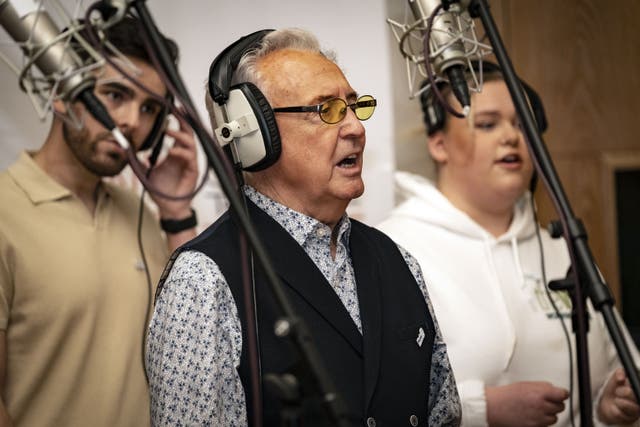 Tony Christie with dementia carers Graeme Sutherland and Katie Neal in the studio recording a version of Thank You For Being A Friend (John Dawson/PA)