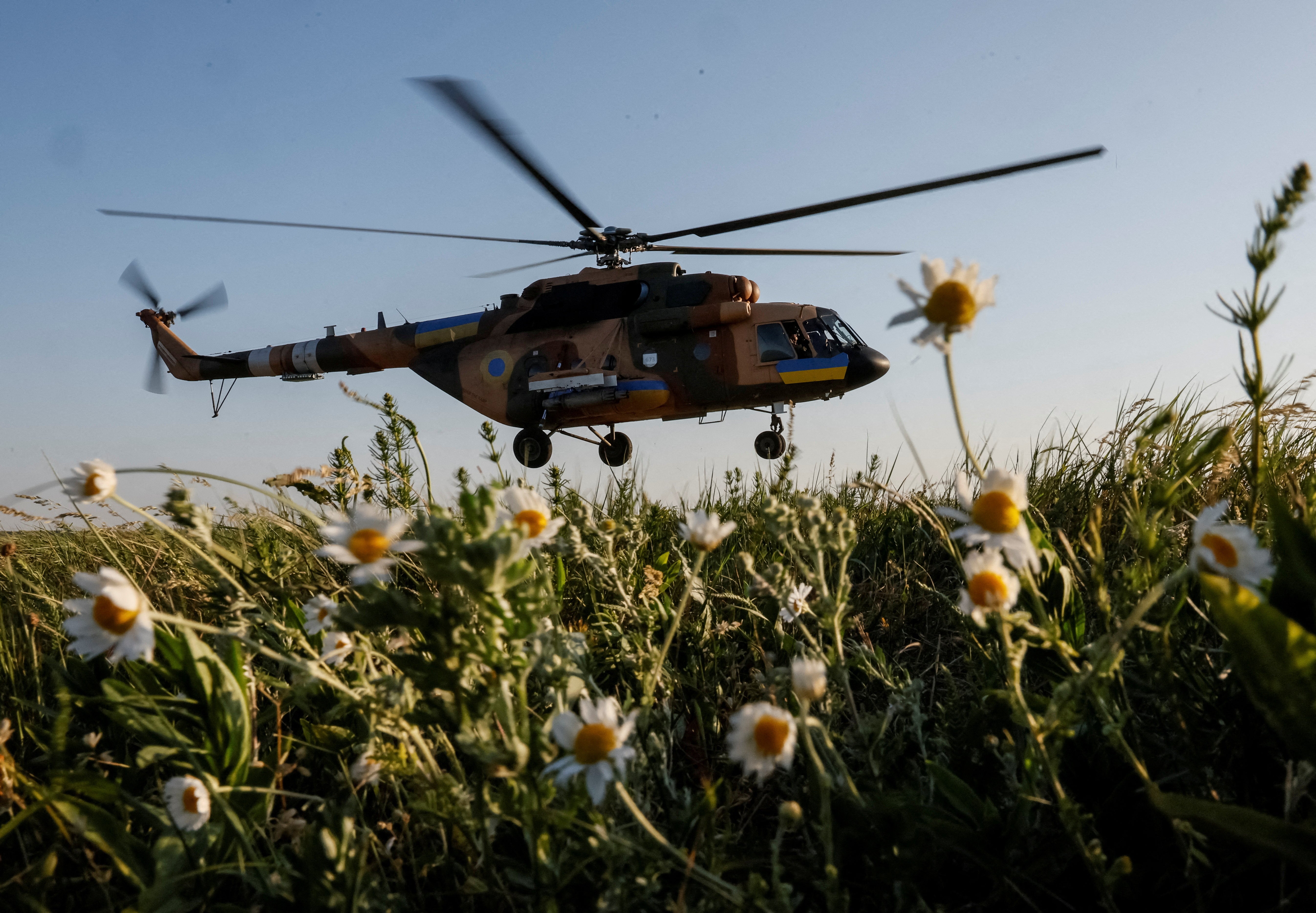 A Ukrainian military helicopter takes off to carry out a mission during military drills in the north of Ukraine, 1 June 2023