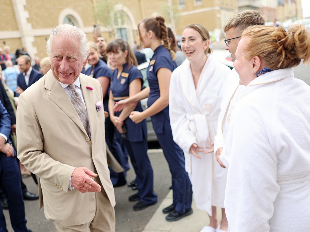 King Charles and Queen Camilla surprise spa guests in bathrobes at eco-village
