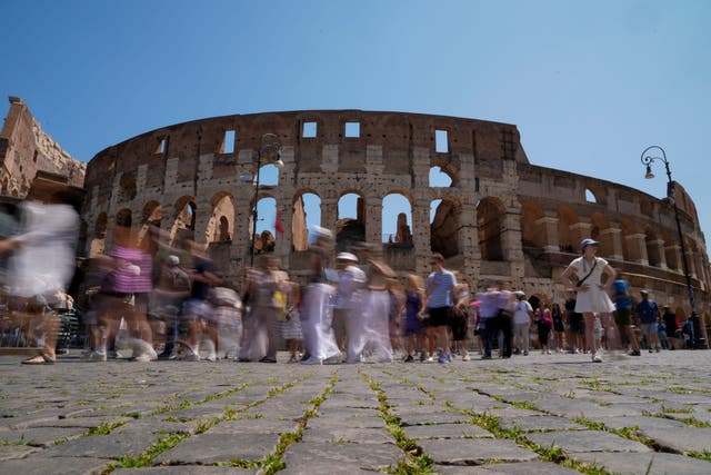 <p>Not all visitors to the Colosseum treat it with  respect </p>