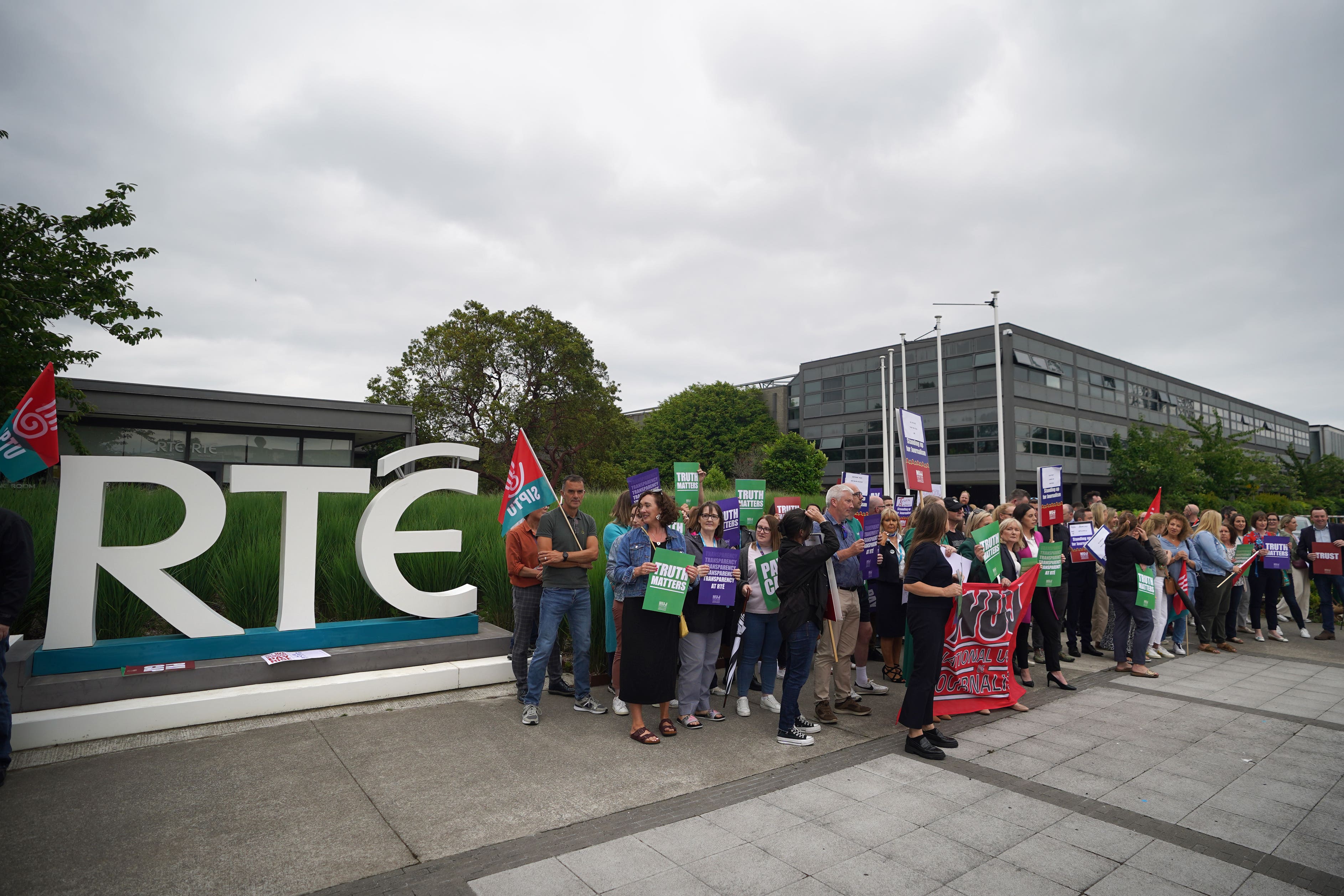 Members of staff from RTE took part in a protest at the broadcaster’s headquarters in Donnybrook, Dublin (Niall Carson/PA)