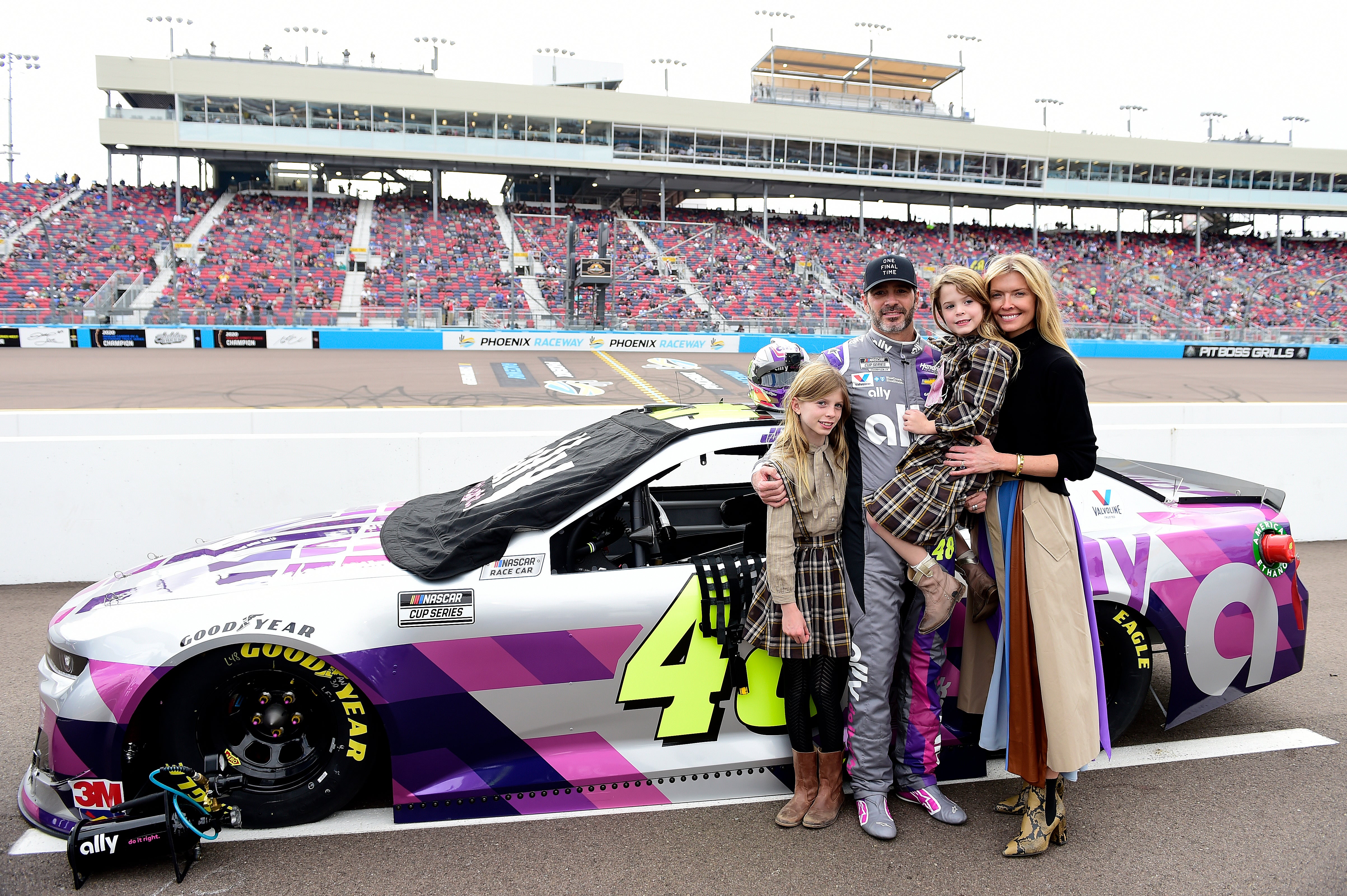 Jimmie Johnson, driver of the #48 Ally Chevrolet, poses on the grid with his wife Chandra Johnson and their daughters Lydia Norriss Johnson and Genevieve Johnson prior to the NASCAR Cup Series Season Finale 500 at Phoenix Raceway on November 08, 2020 in Avondale, Arizona.