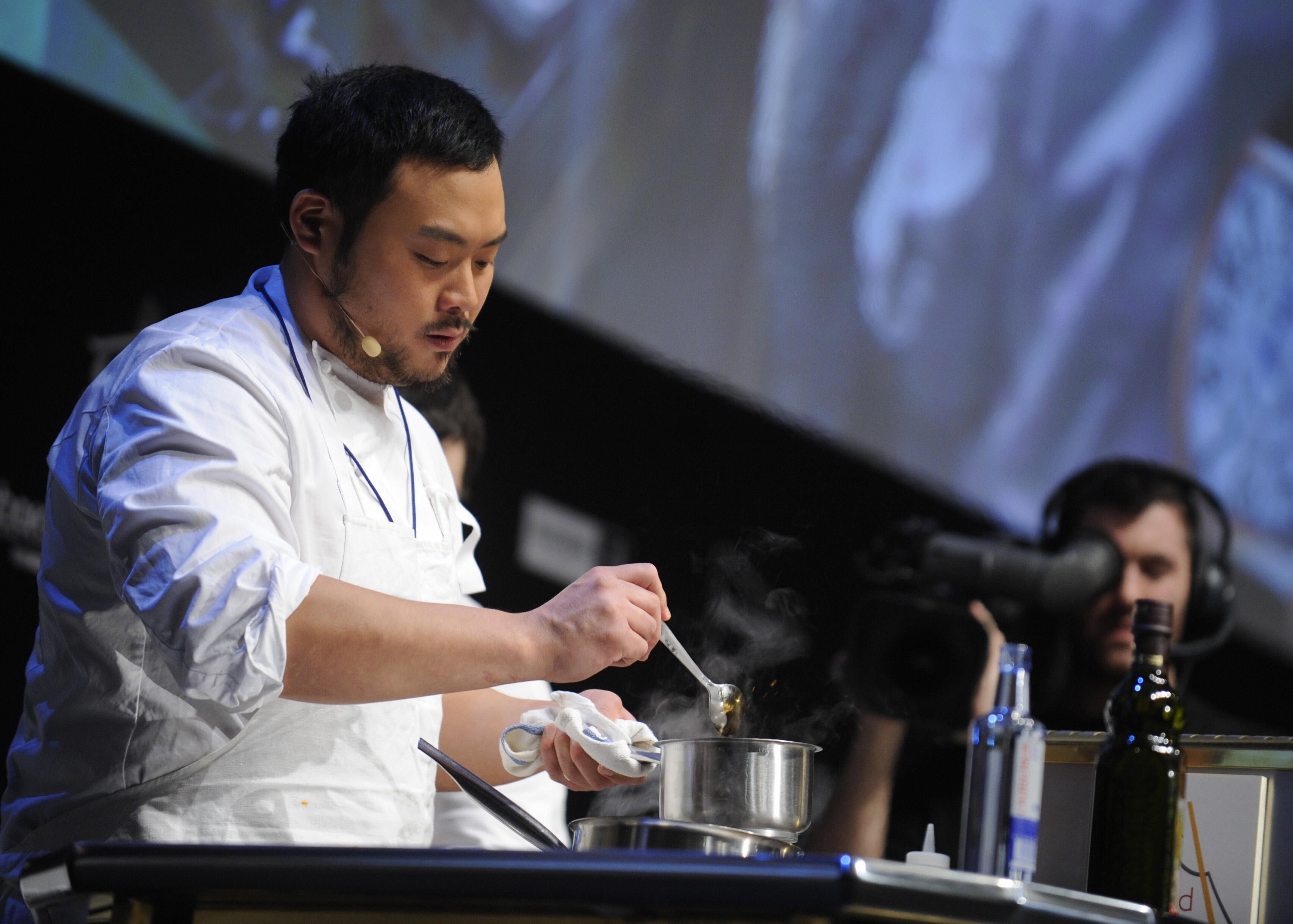 David Chang presents a recipe during the gastronomic fair "Madrid Fusion" on January 21, 2009