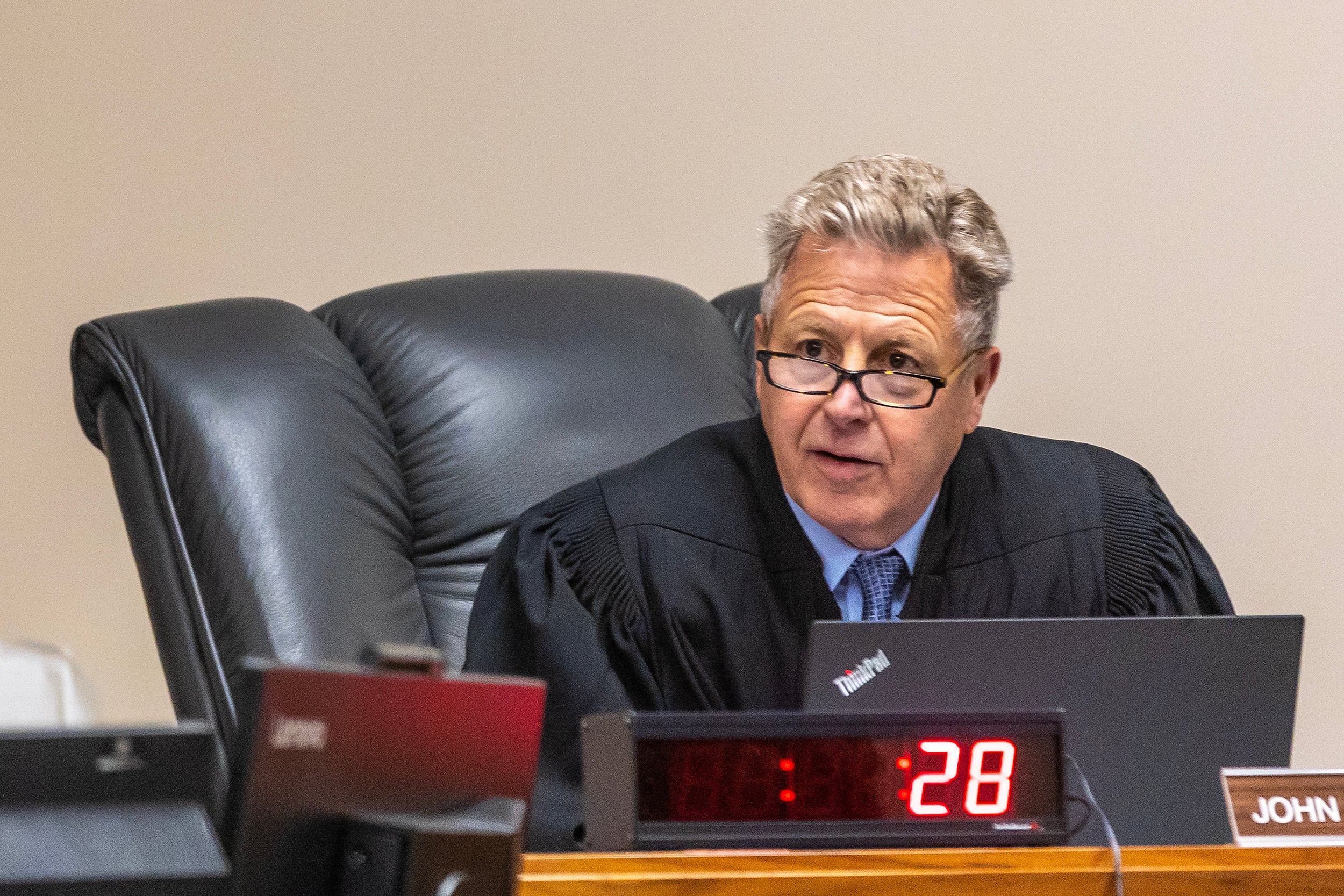 Judge John Judge speaks during a hearing