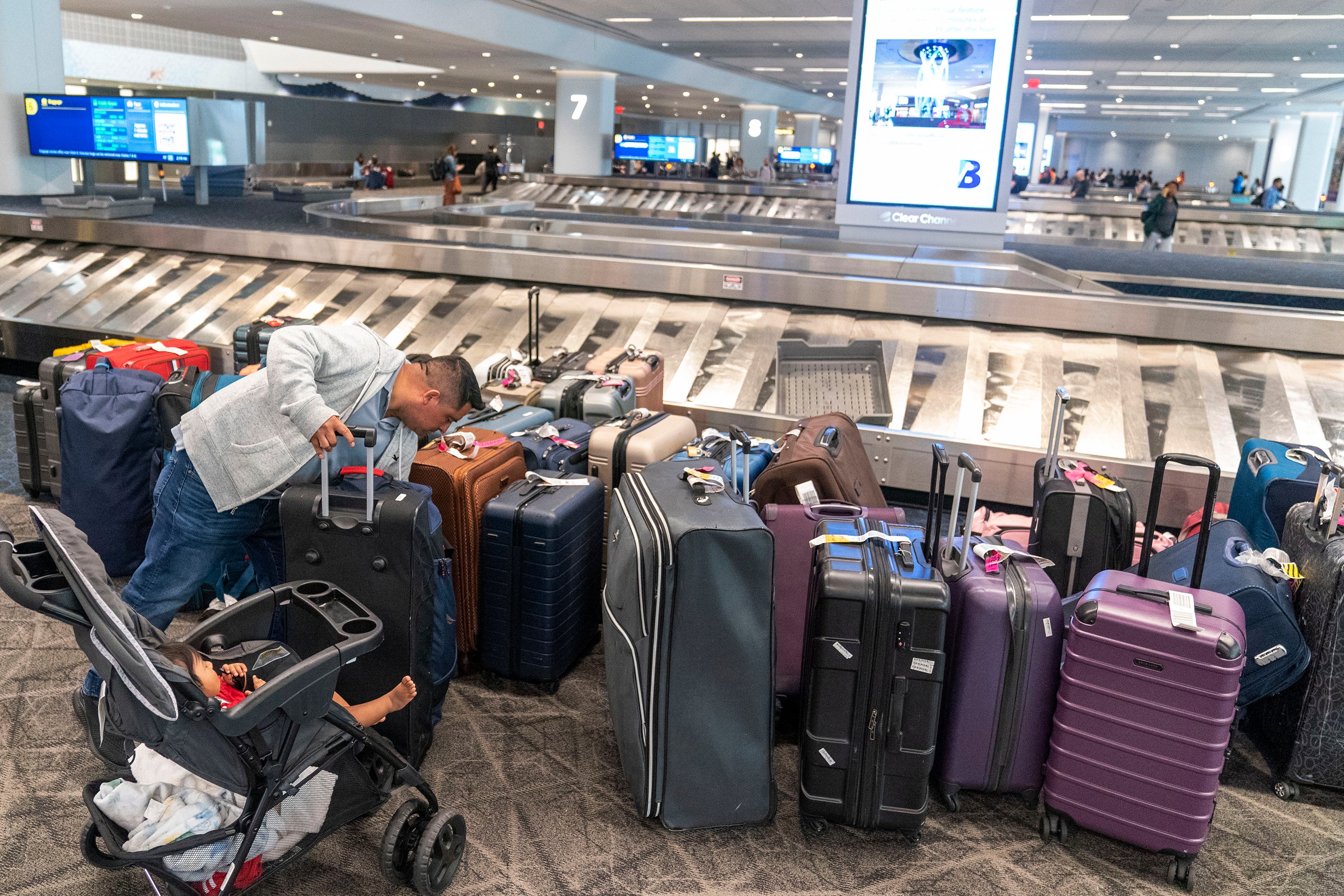 Baggage sits unclaimed at LaGuardia Airport amid delays on Tuesday