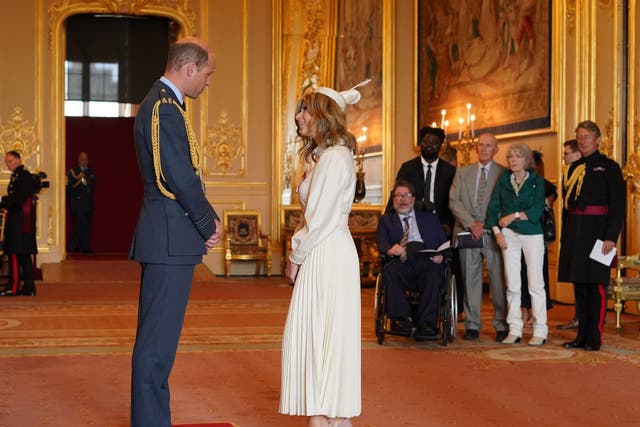 <p>Kate Garraway was made an MBE by the Prince of Wales at Windsor Castle, as her husband, Derek Draper, watched from a wheelchair nearby (Jonathan Brady/PA)</p>