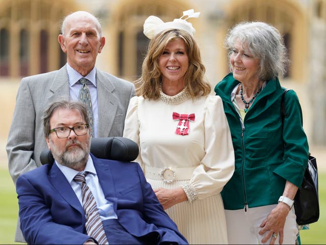 <p>Kate Garraway, with her husband Derek Draper and her parents Gordon and Marilyn Garraway, after being made a Member of the Order of the British Empire for her services to broadcasting, journalism and charity by the Prince of Wales during an investiture ceremony at Windsor Castle, on June 28, 2023</p>