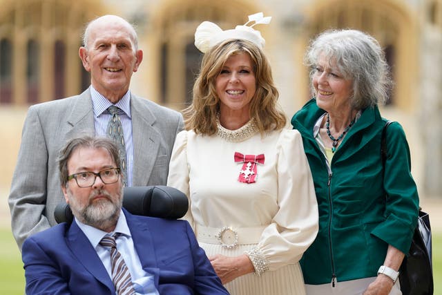<p>Kate Garraway, with her husband Derek Draper and her parents Gordon and Marilyn Garraway, after being made a Member of the Order of the British Empire for her services to broadcasting, journalism and charity by the Prince of Wales during an investiture ceremony at Windsor Castle, on June 28, 2023</p>