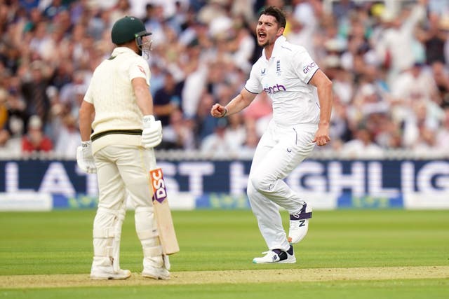 Josh Tongue celebrates taking the wicket of Australia’s David Warner (Adam Davy/PA)