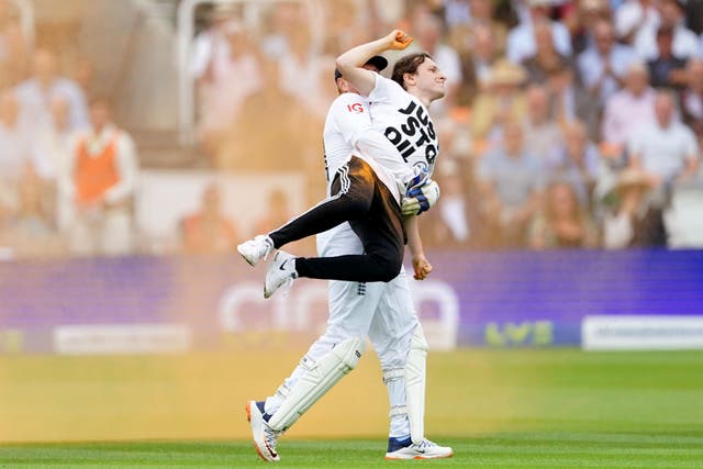 England’s Jonny Bairstow removes a Just Stop Oil protester from the pitch during day one of the second Ashes test match at Lord’s, London. Picture date: Wednesday June 28, 2023.