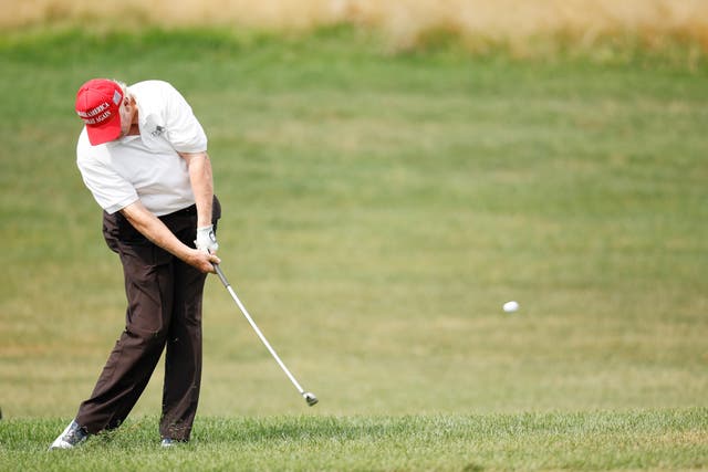<p>Former US President Donald Trump plays a shot on the first hole during the pro-am prior to the LIV Golf Invitational - Bedminster at Trump National Golf Club Bedminster on July 28, 2022 in Bedminster, New Jersey. </p>