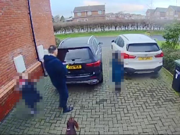 Screengrab issued by Lancashire Police of doorbell footage showing Nicola Bulley, her partner Paul Ansell, and her children outside their home on the morning she vanished