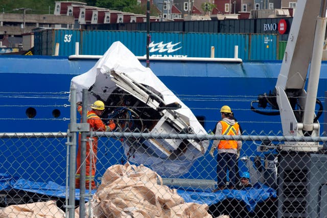 Debris from the Titan submersible is unloaded (Paul Daly/The Canadian Press/AP)