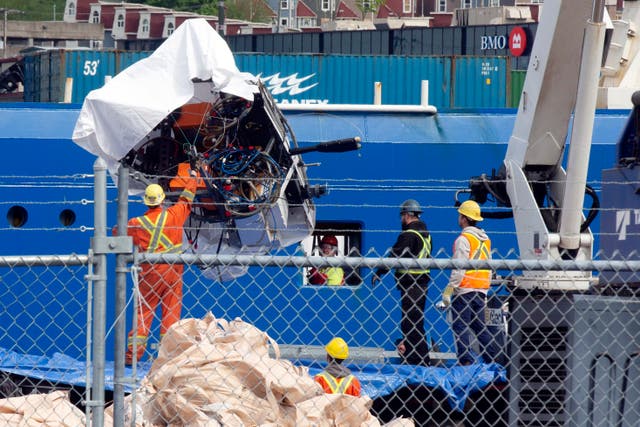 <p>Debris from the Titan submersible, recovered from the ocean floor near the wreck of the Titanic, is unloaded from the ship Horizon Arctic at the Canadian Coast Guard pier in St. John's, Newfoundland, Wednesday, June 28, 2023. </p>