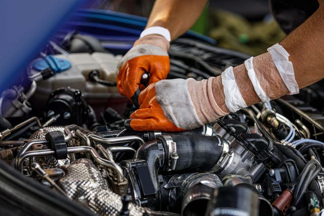 Nearly one in four drivers are either putting off getting their vehicles serviced or doing it themselves due to cost of living pressures, a new survey suggests (Alamy/PA)
