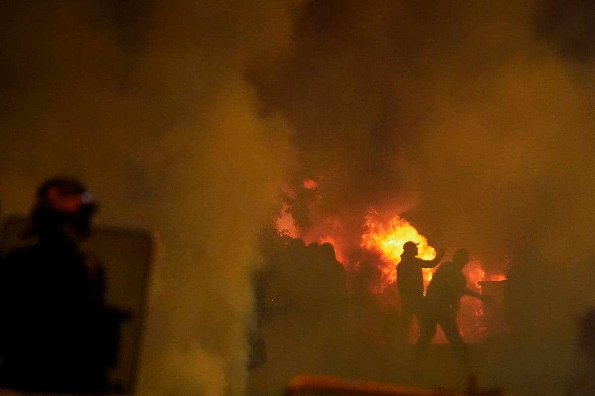 Second night of riots erupt in Paris over police killing of teenager as 150 arrested