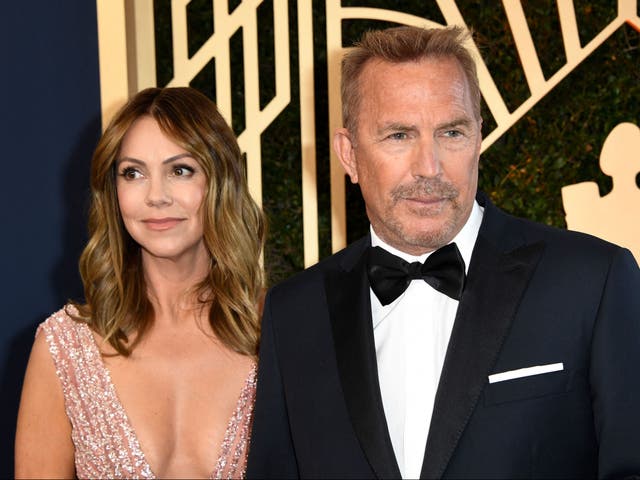 <p>Kevin Costner and his wife Christine Baumgartner arrive for the 28th Annual Screen Actors Guild (SAG) Awards at the Barker Hangar in Santa Monica, California, on February 27, 2022</p>