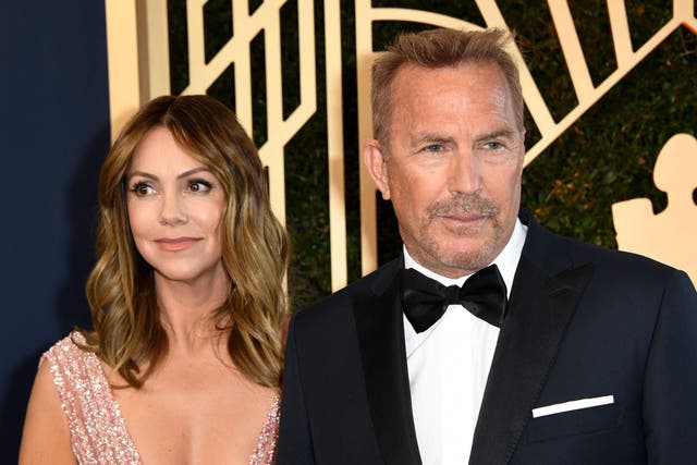 <p>Kevin Costner and his wife Christine Baumgartner arrive for the 28th Annual Screen Actors Guild (SAG) Awards at the Barker Hangar in Santa Monica, California, on 27 February 2022</p>