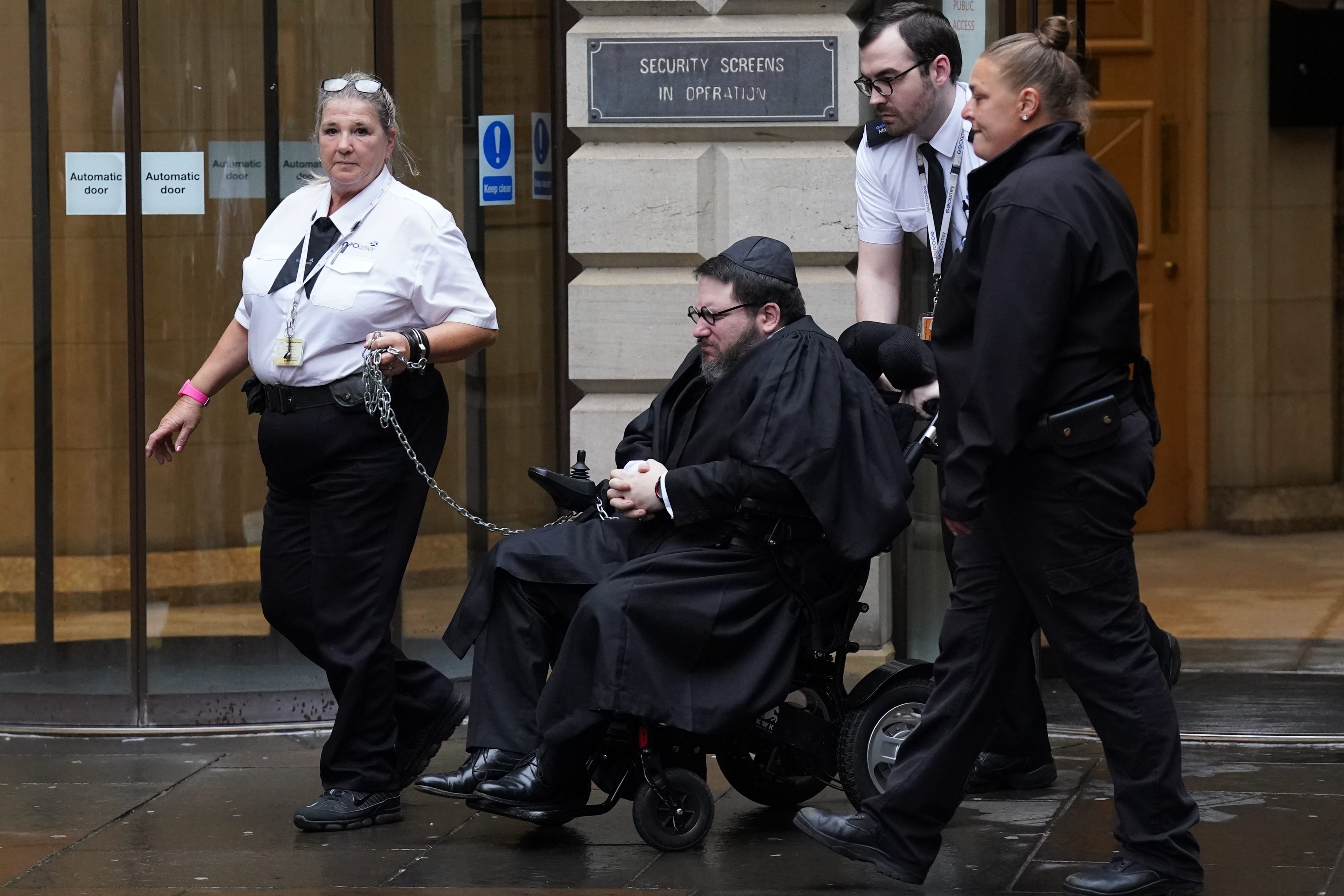 Nicholas Rossi told the court he is unable to raise his arms above his head (Andrew Milligan/PA)