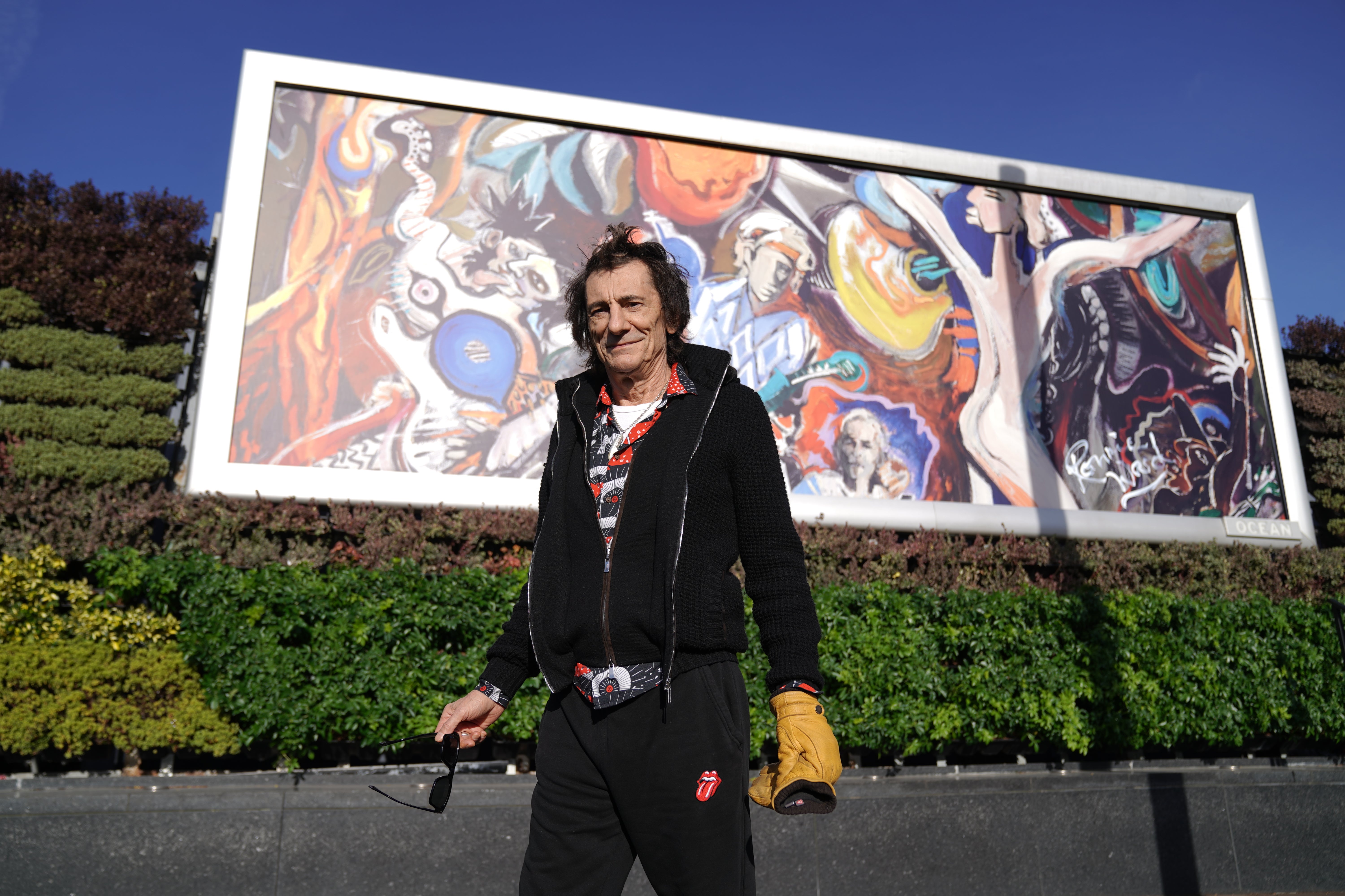 If in doubt, paint it black... Ronnie Wood stands in front of one of his less controversial pieces