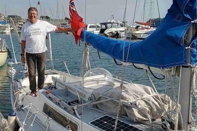 <p>Duncan Lougee on his yacht, the Minke</p>