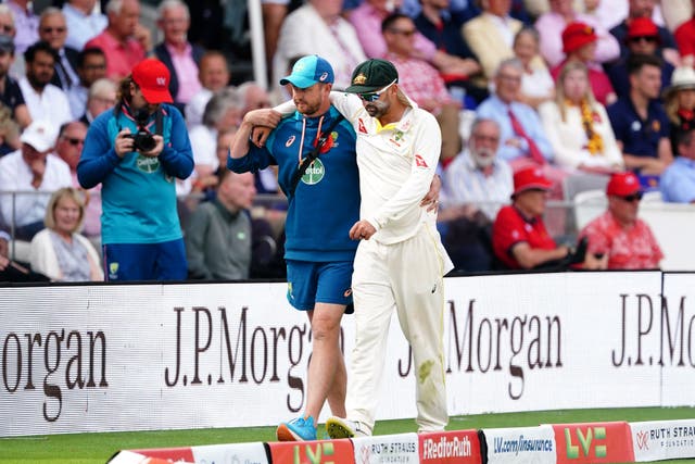 Nathan Lyon had to be helped around the boundary edge by a member of Australia’s medical team (Mike Egerton/PA)