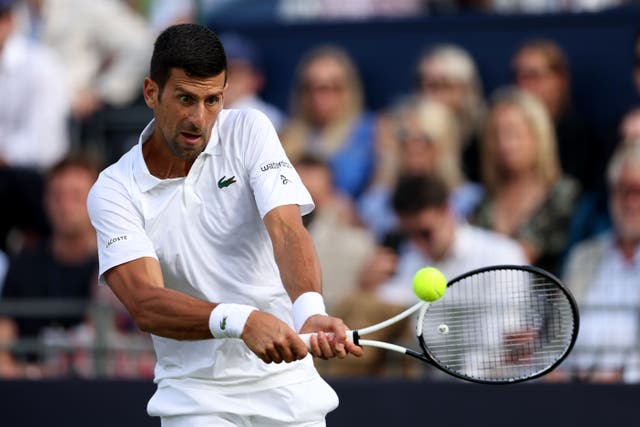 Novak Djokovic hits a backhand during his victory over Frances Tiafoe (Steven Paston/PA)