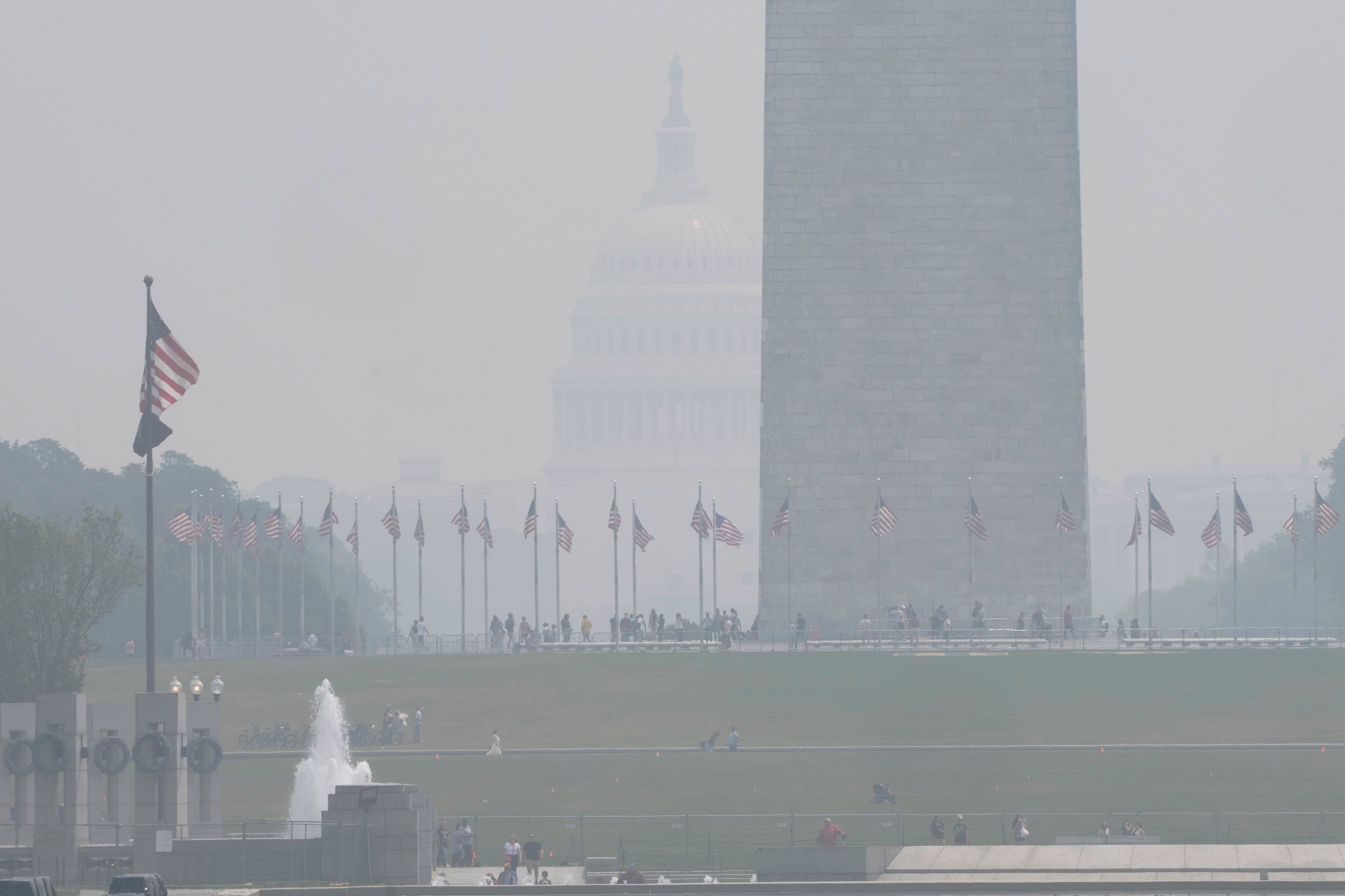 The National Mall is hazy with smoke from wildfires in Canada obscuring the view of the Capitol almost completely past the Washington Monument, as seen from the Lincoln Memorial plaza, 29 June 2023