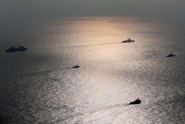 <p>A handout picture made available by the Iranian Army official website on January, 21 2022 shows Iranian, Russia and Chinese warships during a joint military drill in the Indian ocean</p>