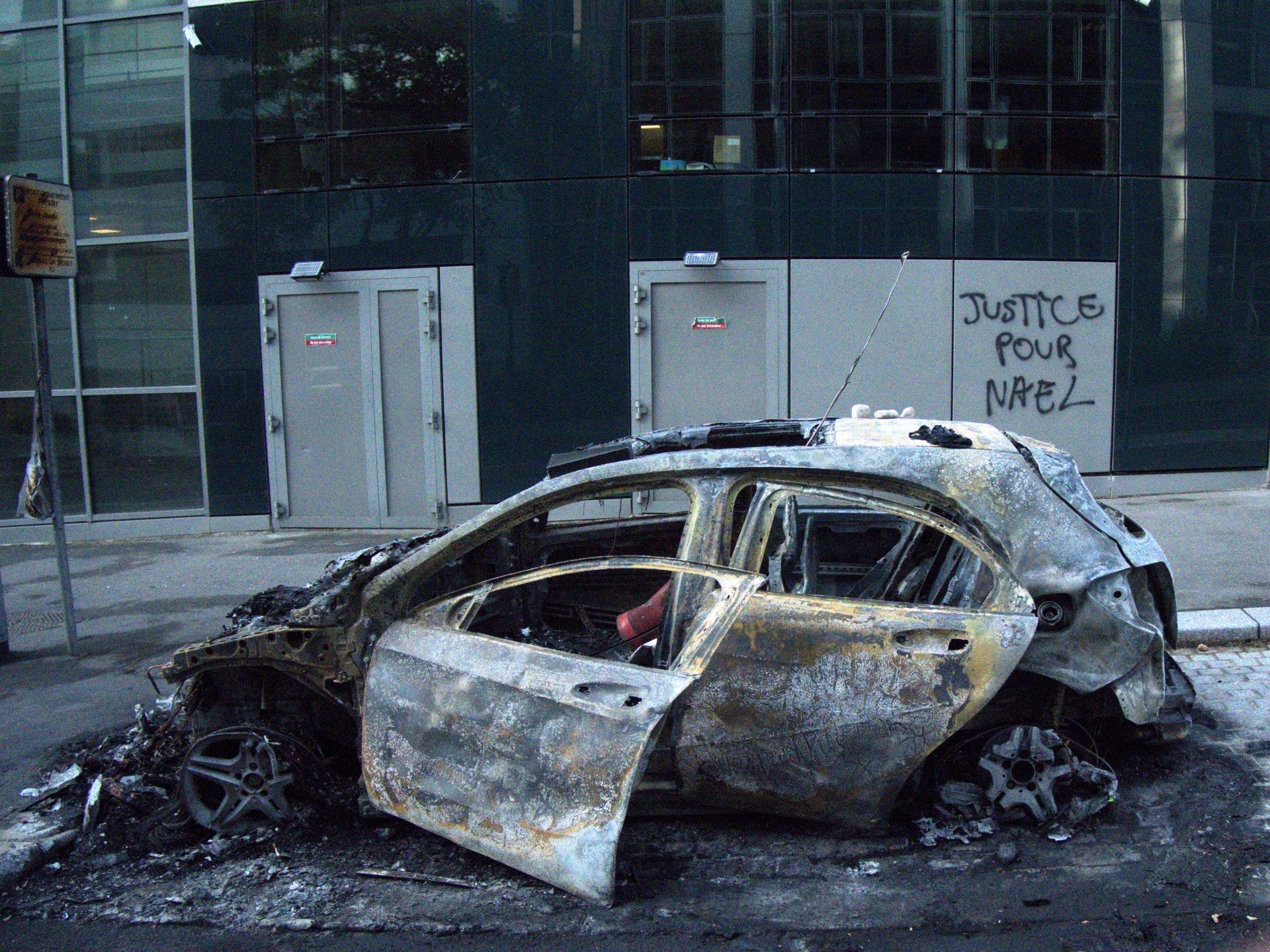 The remains of a car in the Paris suburb of Nanterre