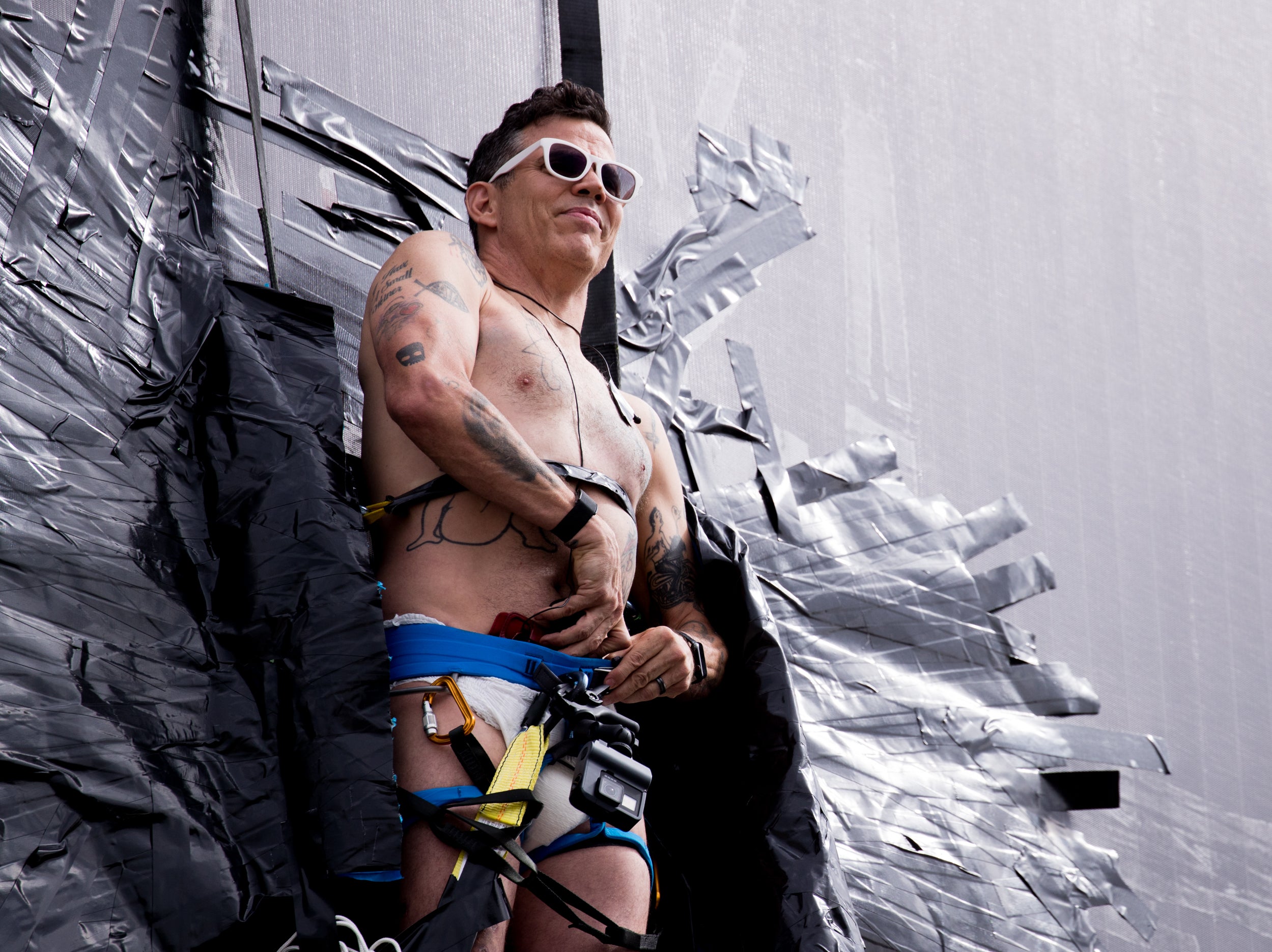 Steve-O pictured duct-taping himself to a billboard in 2020 as a promotional stunt