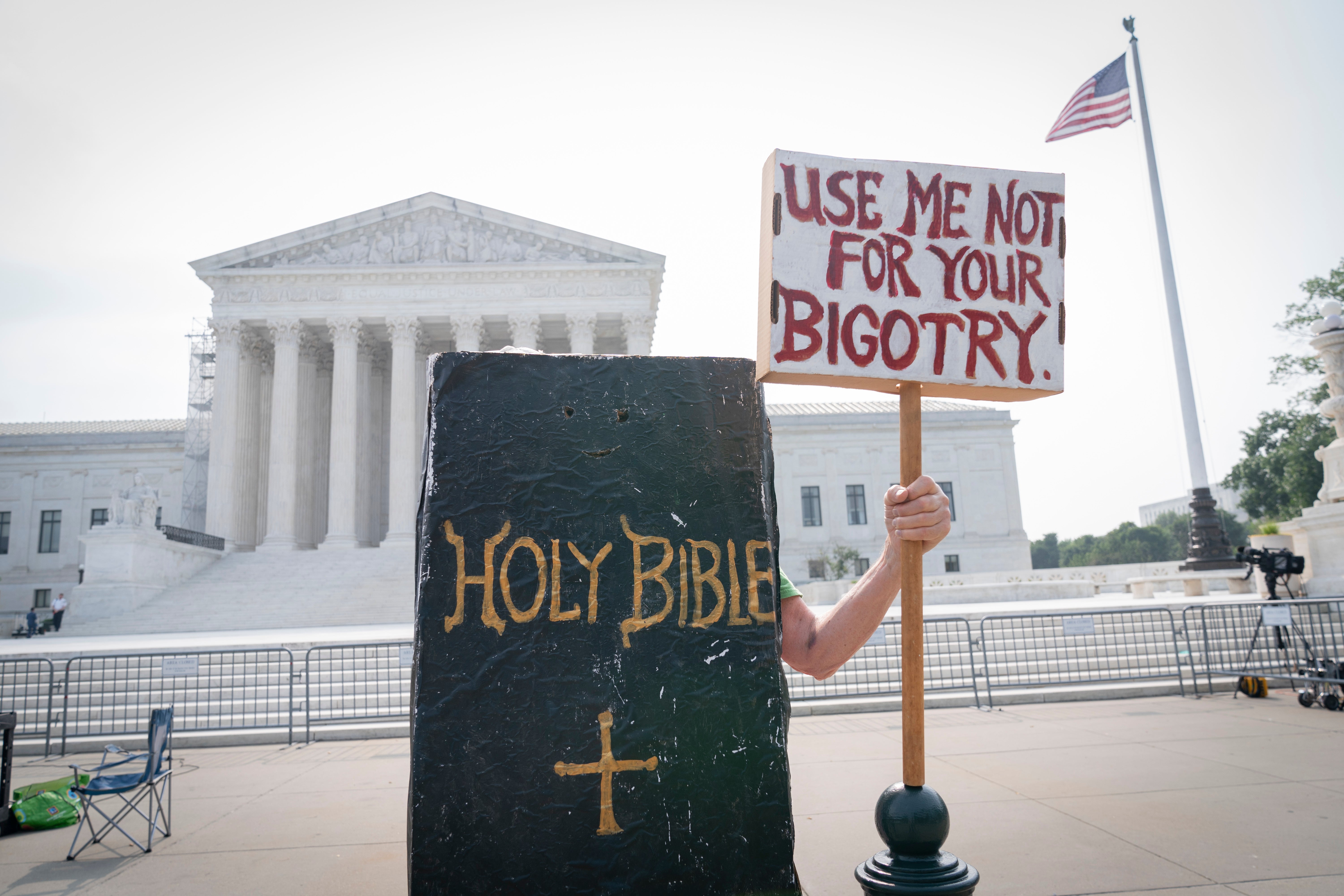 A person protests outside the Supreme Court