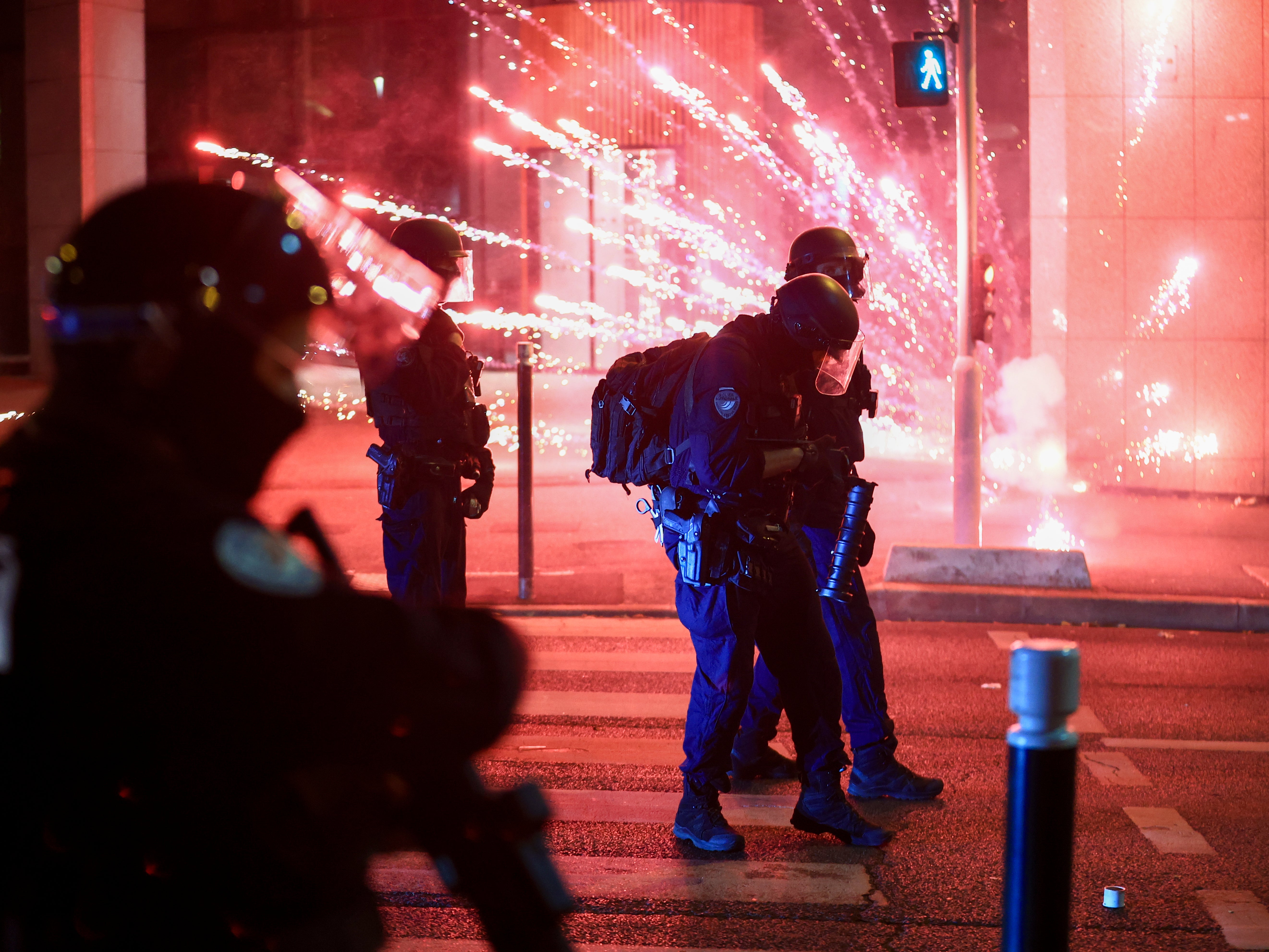 Riot police face demonstrators