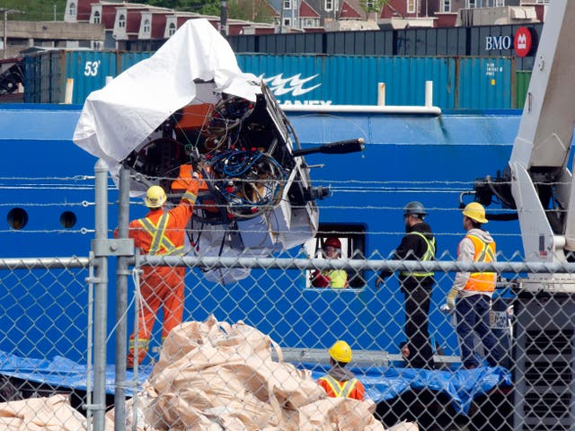 <p>Debris from the Titan submersible, recovered from the ocean floor near the wreck of the Titanic, is unloaded from the ship Horizon Arctic at the Canadian Coast Guard pier in St. John's, Newfoundland, Wednesday, June 28, 2023</p>