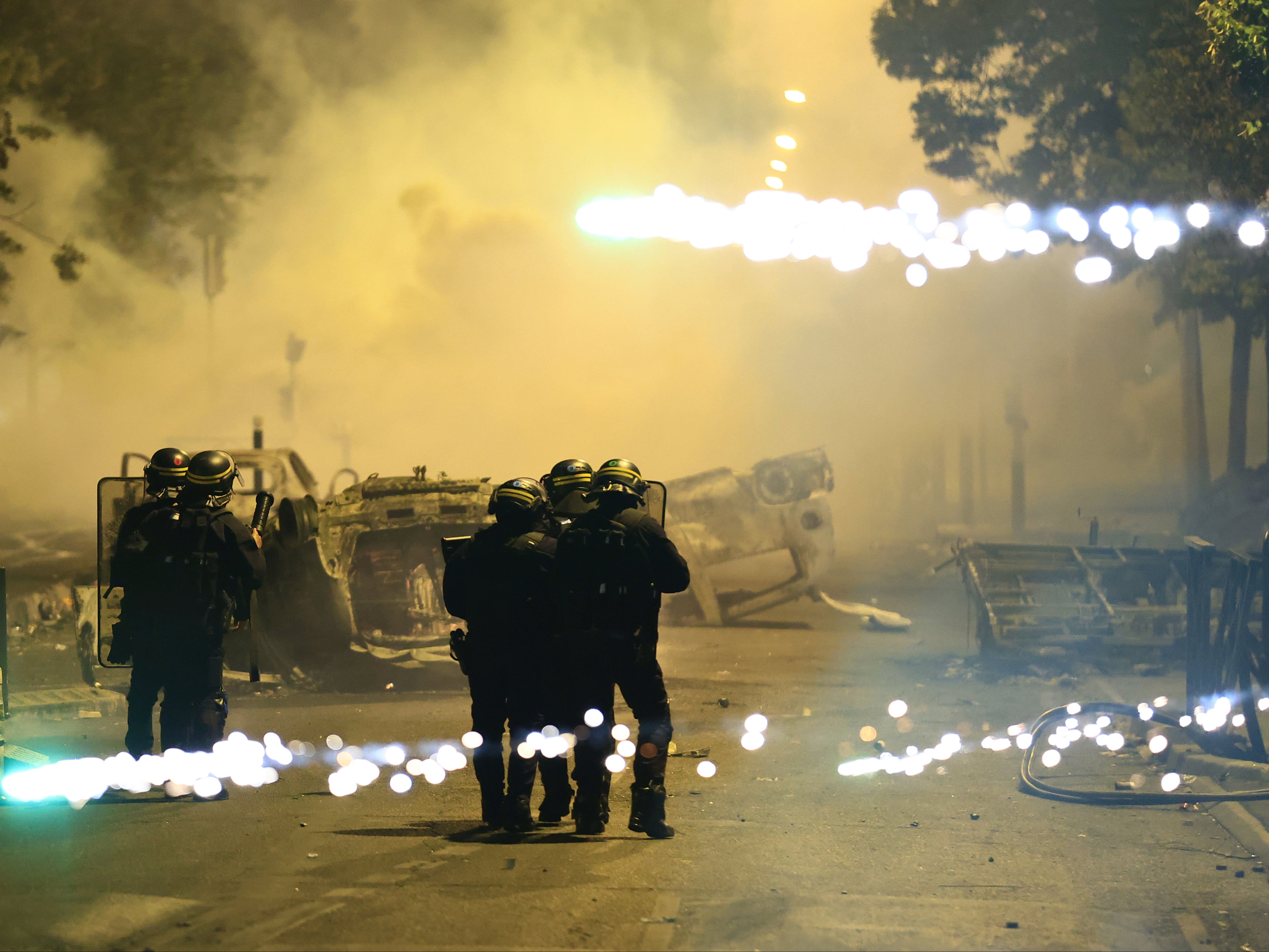 Fires were burning after cars were overturned in Nanterre