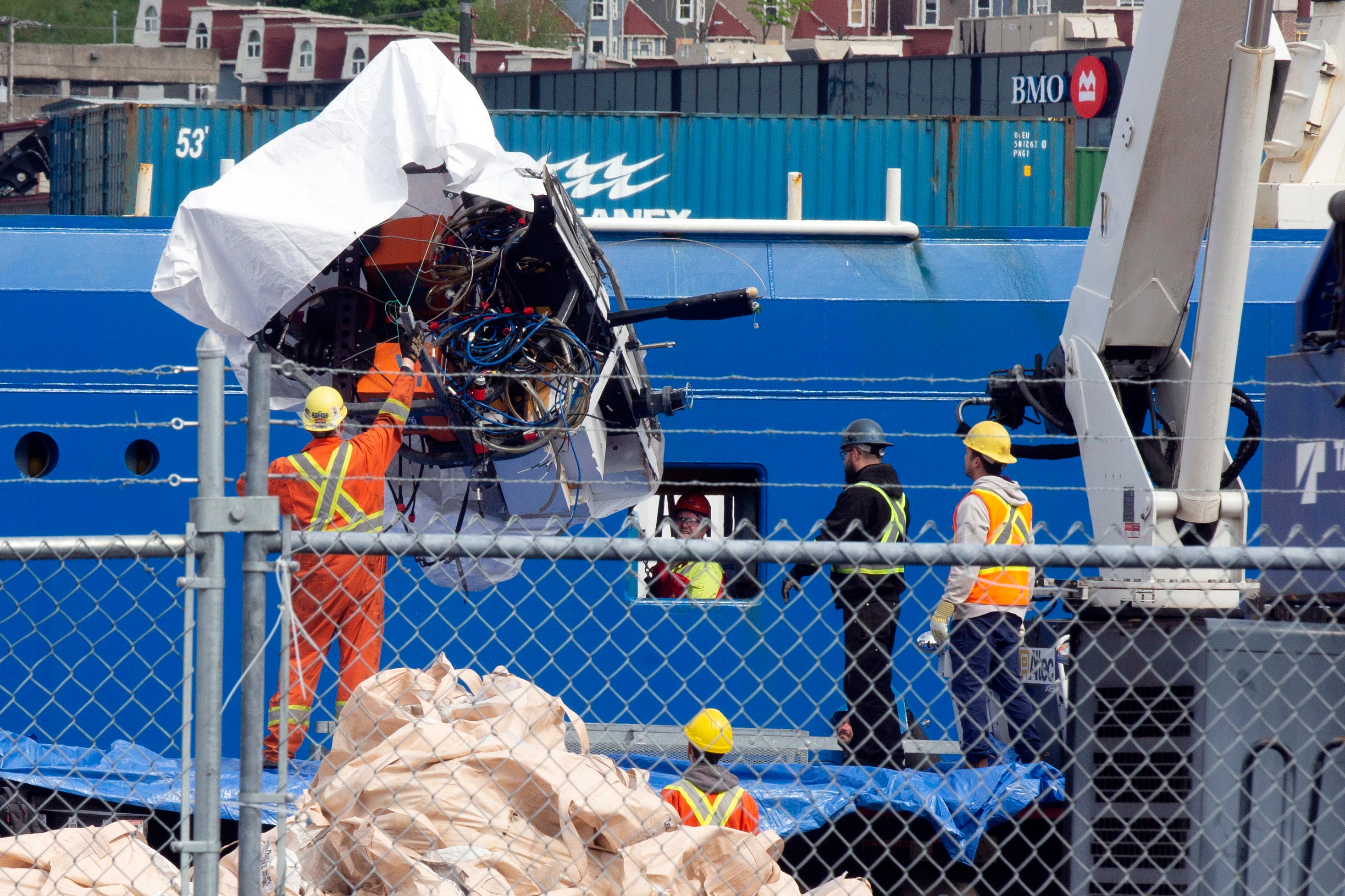 Debris from the Titan submersible, recovered from the ocean floor near the wreck of the Titanic, is unloaded from the ship Horizon Arctic at the Canadian Coast Guard pier in St. John's, Newfoundland, Wednesday, June 28, 2023